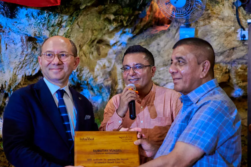 Turkish Ambassador to Kenya H.E. Subutay Yüksel is awarded a plaque by PrideInn MD during the official opening of the Istanbul Beach Cave Restaurant
