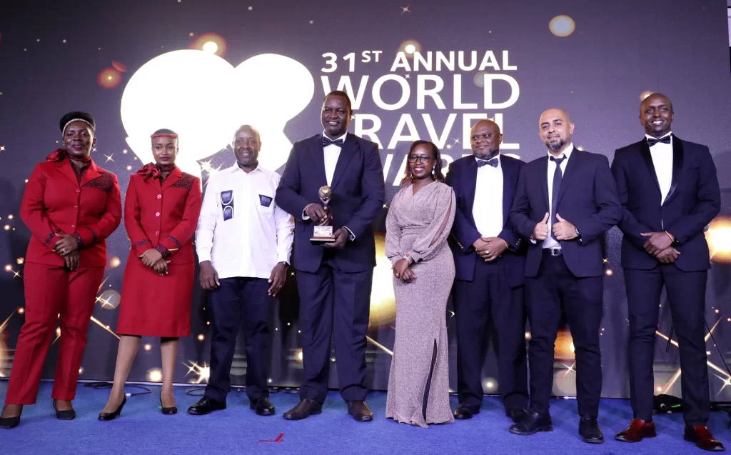 KQ CEO Allan Kilavuka with the PrideInn Azure GM & Management Team at The World Travel Awards Gala 2024